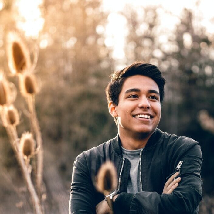 A male smiling and enjoying the outdoor